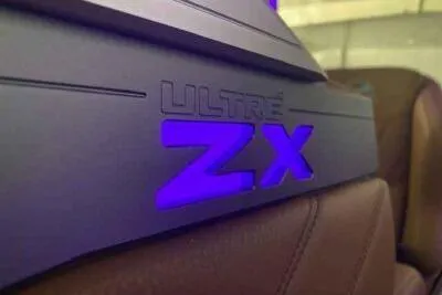 Slide: The Image of 2025 Tigé Ultré 25ZX boat interior with illuminated ZX logo. - 8