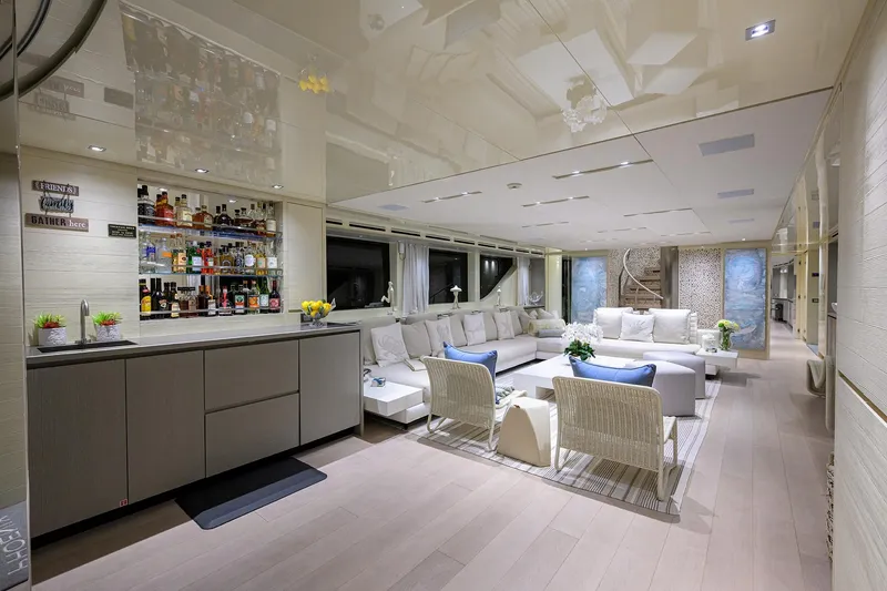 Slide: The Image of Luxurious interior of 2019 Sanlorenzo SD112 yacht with elegant seating and a well-stocked bar. - 15