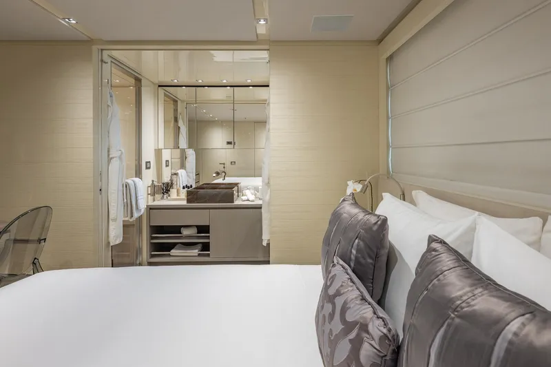 Slide: The Image of Luxurious bedroom and bathroom on 2019 Sanlorenzo SD112 yacht, featuring elegant decor and plush bedding. - 46