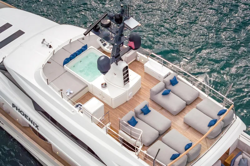 Slide: The Image of Luxurious 2019 Sanlorenzo SD112 yacht with spacious deck and jacuzzi, cruising on open water. - 57