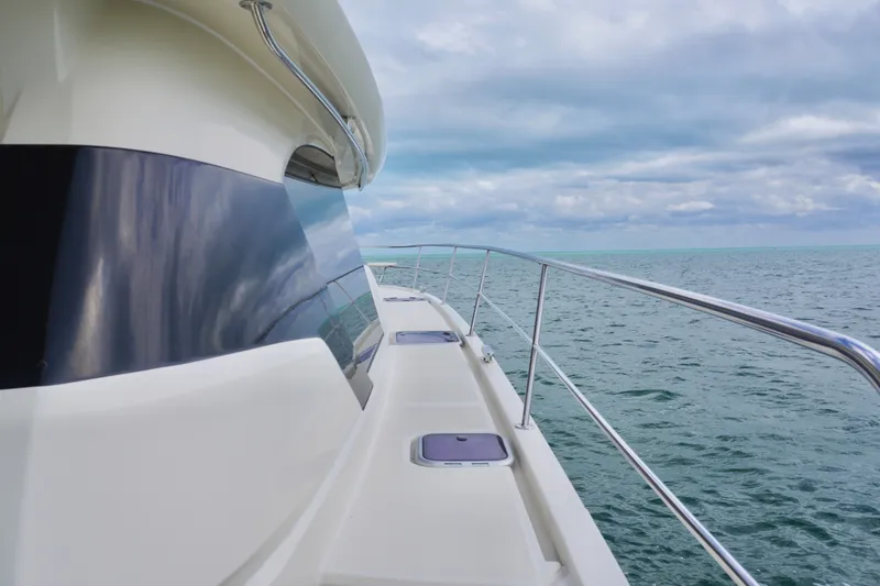 Slide: The Image of 2017 Aquila 44 Yacht cruising on open sea under cloudy skies. - 10