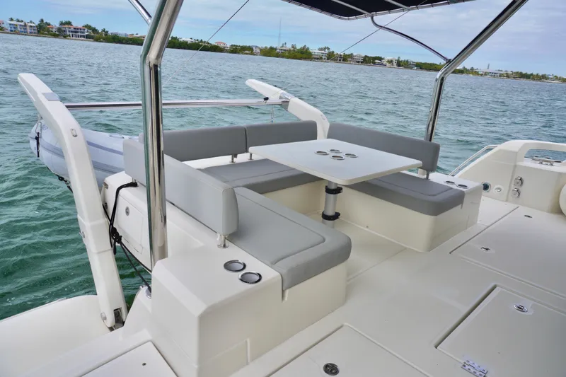 Slide: The Image of 2017 Aquila 44 Yacht with outdoor seating and table on calm waters. - 13