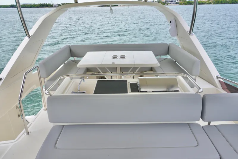 Slide: The Image of Luxurious 2017 Aquila 44 Yacht with spacious outdoor seating and dining area. - 17
