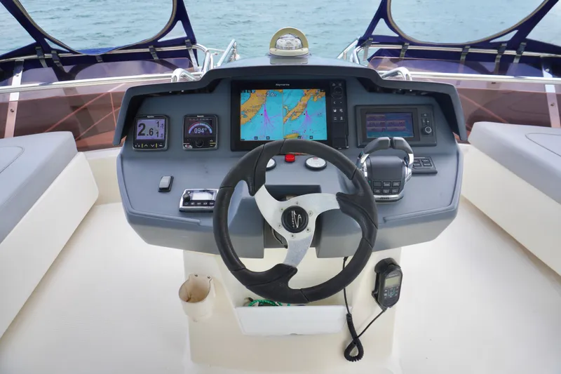 Slide: The Image of Cockpit of 2017 Aquila 44 Yacht with navigation controls and display screens. - 20