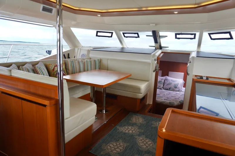 Slide: The Image of Interior of 2017 Aquila 44 Yacht with dining area and cabin view. - 22