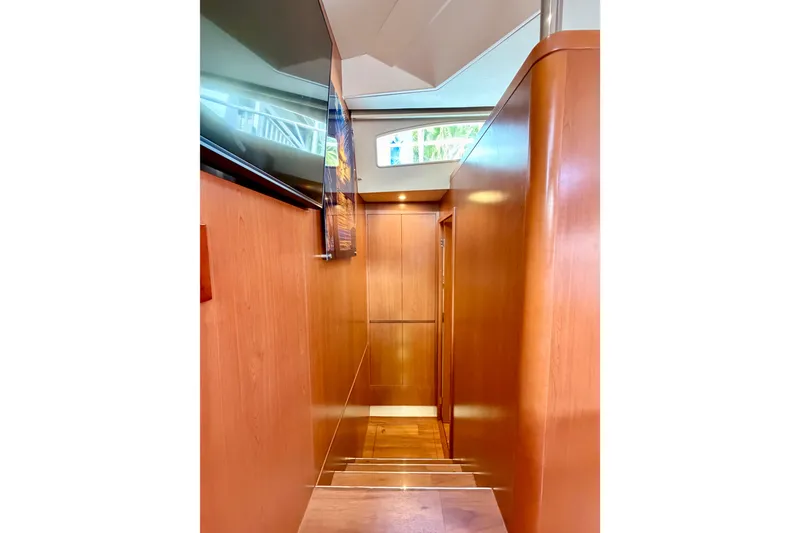 Slide: The Image of Interior hallway of 2017 Aquila 44 Yacht with wooden paneling and modern design. - 27