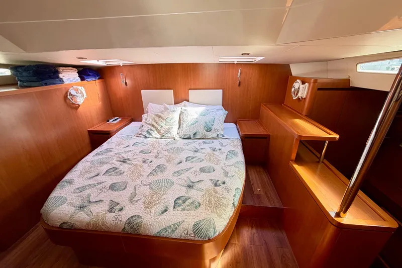 Slide: The Image of Luxurious cabin interior of 2017 Aquila 44 Yacht with cozy bedding and wooden finish. - 28
