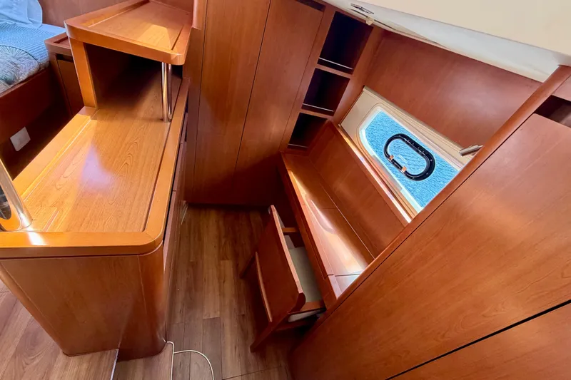 Slide: The Image of Interior of 2017 Aquila 44 Yacht with wooden cabinetry and window view. - 30