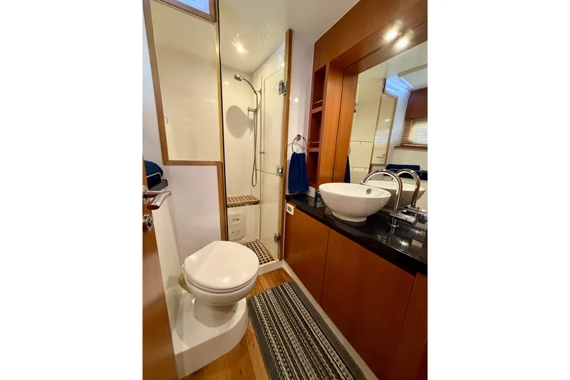 Slide: The Image of Luxurious bathroom in 2017 Aquila 44 Yacht with modern fixtures and elegant design. - 32