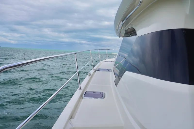 Slide: The Image of Side view of 2017 Aquila 44 Yacht on open sea under cloudy sky. - 9