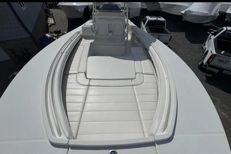 Slide: The Image of 2018 Regulator 34 Center Console boat with spacious white seating area. - 10
