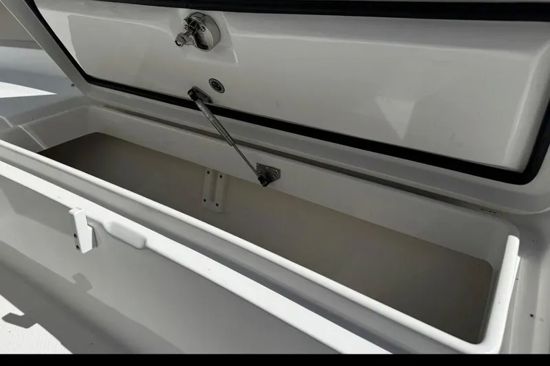 Slide: The Image of Open storage compartment on 2018 Regulator 34 Center Console boat. - 11