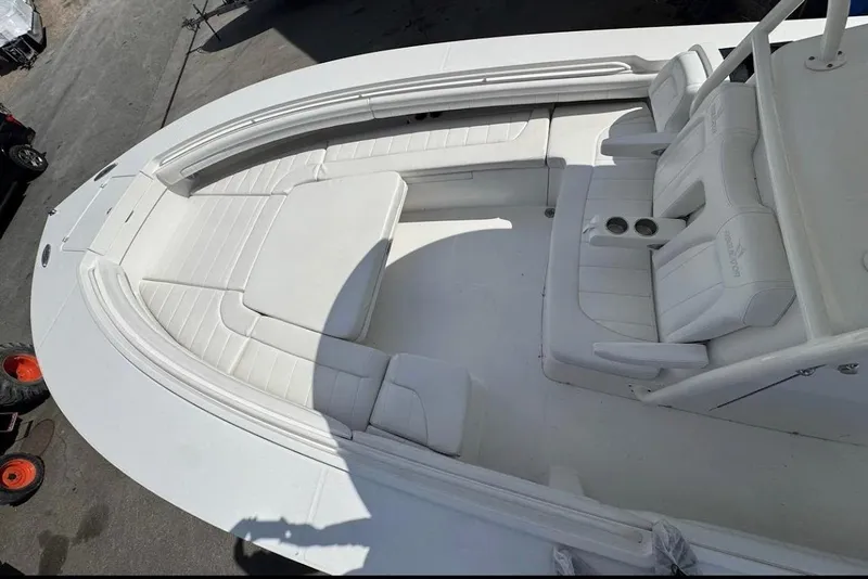Slide: The Image of 2018 Regulator 34 Center Console boat interior with white seating and console area. - 14