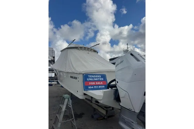 Slide: The Image of 2018 Regulator 34 Center Console boat for sale, covered, with Mercury engines. - 7