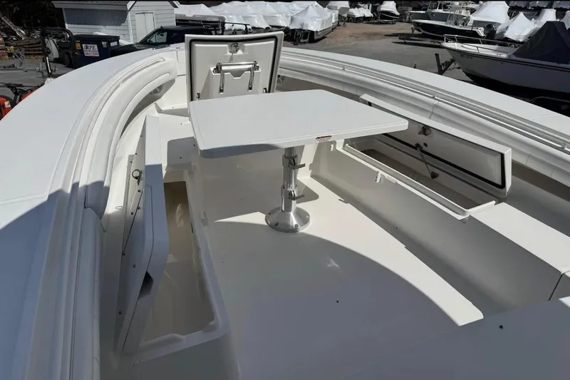 Slide: The Image of 2018 Regulator 34 Center Console boat interior with seating and storage compartments. - 9