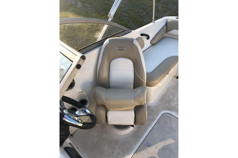Slide: The Image of 2019 Stingray 191 LX boat interior with beige and white seating. - 6