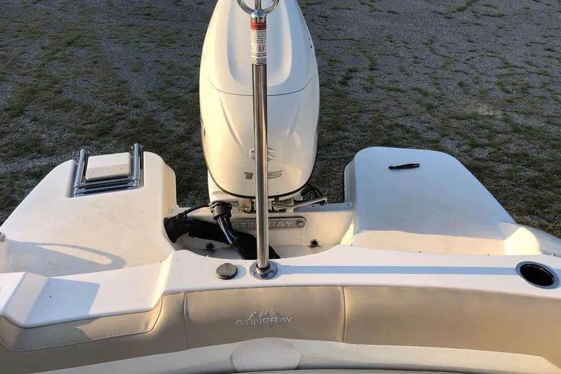 Slide: The Image of 2019 Stingray 191 LX boat stern with outboard motor and swim platform. - 8