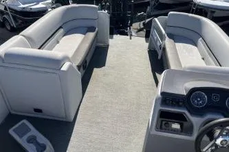 Slide: The Image of 2022 Godfrey Sweetwater 2286 C pontoon boat interior with seating and dashboard. - 12