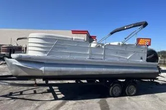 Slide: The Image of 2022 Godfrey Sweetwater 2286 C pontoon boat on trailer, parked outdoors. - 5