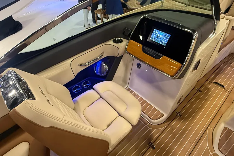 Slide: The Image of Luxurious interior of 2026 Chris-Craft Launch 27 boat with modern dashboard and seating. - 19