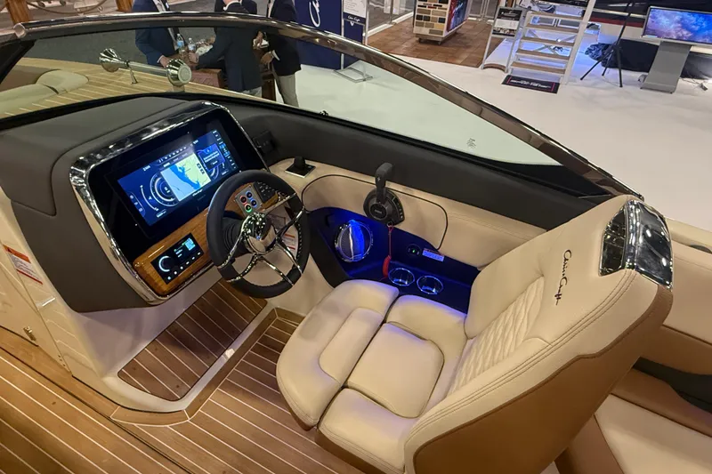 Slide: The Image of 2026 Chris-Craft Launch 27 boat interior with modern dashboard and luxurious seating. - 21