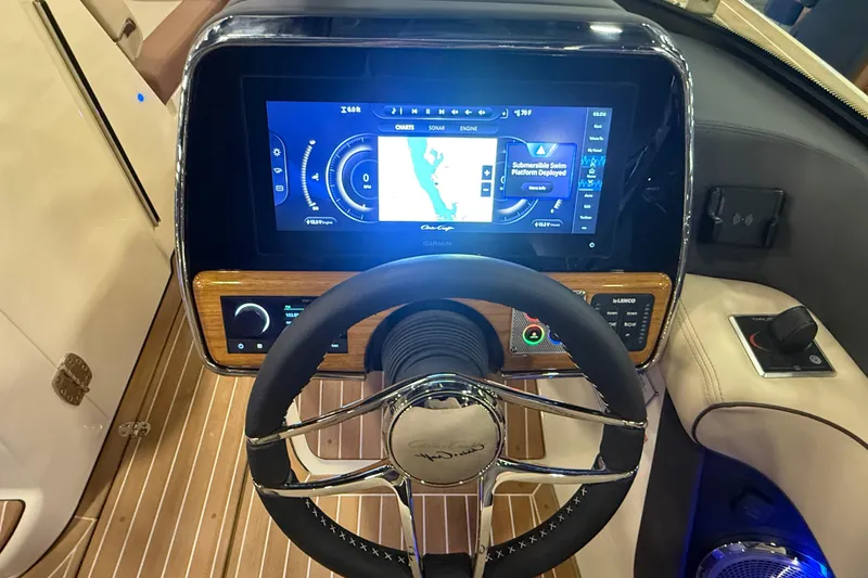 Slide: The Image of 2026 Chris-Craft Launch 27 dashboard with modern navigation display and steering wheel. - 22