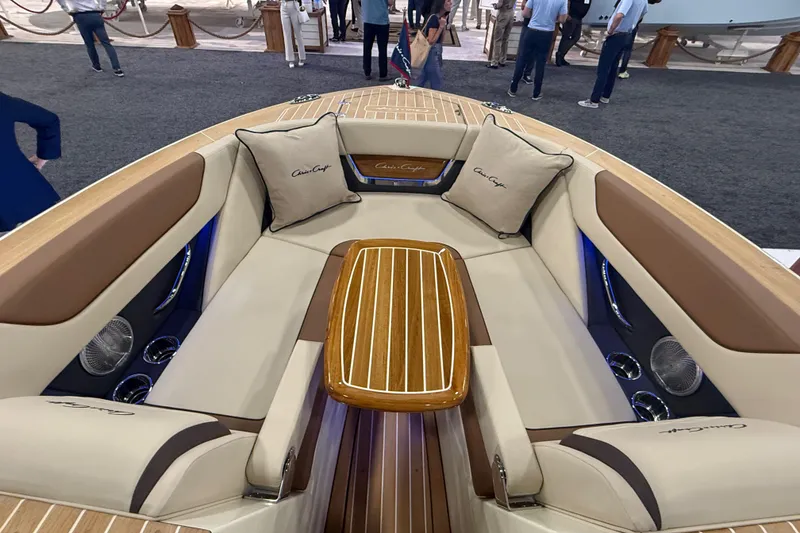 Slide: The Image of Luxurious interior of 2026 Chris-Craft Launch 27 boat with elegant seating and wooden table. - 26