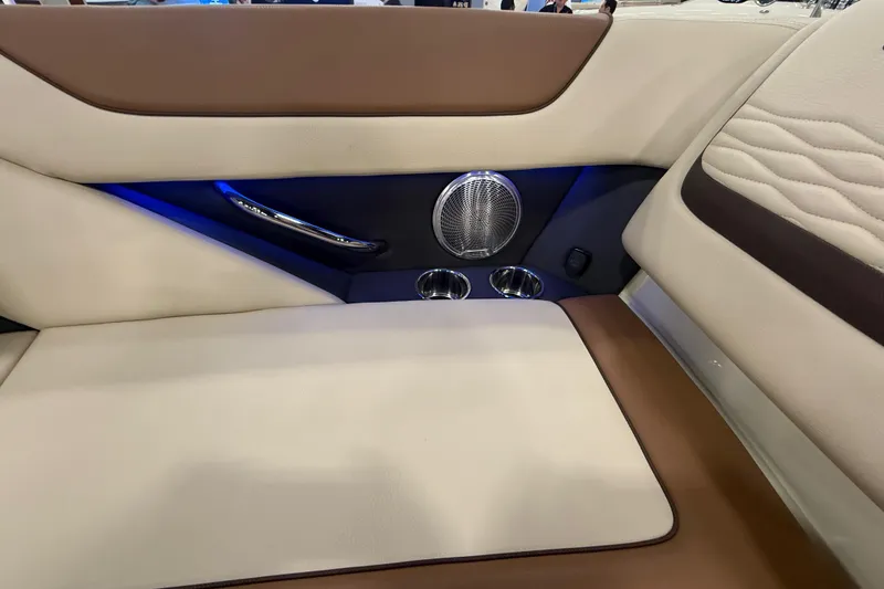 Slide: The Image of Luxurious interior of 2026 Chris-Craft Launch 27 boat with elegant seating and speaker system. - 27