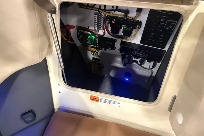 Slide: The Image of Interior view of 2026 Chris-Craft Launch 27 boat's electrical panel and wiring. - 29