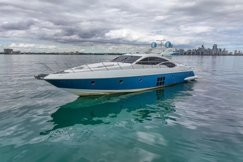 The Image of Luxury 2006 Azimut 68S yacht on calm water with city skyline in background. - 0
