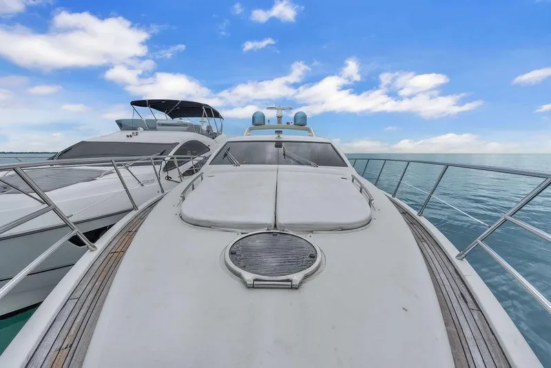 Slide: The Image of 2006 Azimut 68S yacht on calm sea under blue sky. - 16