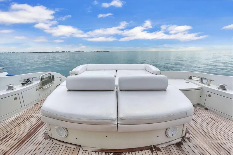 Slide: The Image of Luxury Azimut 68S yacht deck with sunbed, overlooking serene ocean and blue sky, 2006 model. - 21