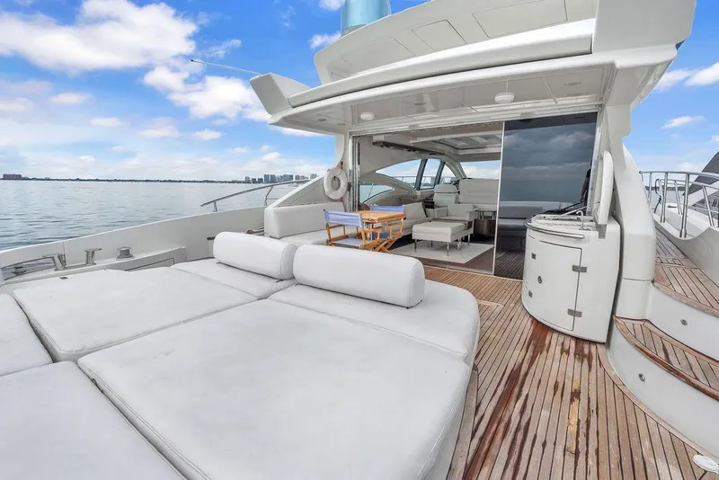 Slide: The Image of Luxurious 2006 Azimut 68S yacht with spacious deck and elegant interior on calm waters. - 22