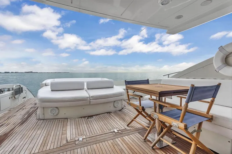 Slide: The Image of Luxury Azimut 68S yacht deck with seating and table, ocean view, 2006 model. - 24