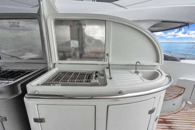 Slide: The Image of Outdoor kitchen on 2006 Azimut 68S yacht with grill and sink, ocean view. - 26