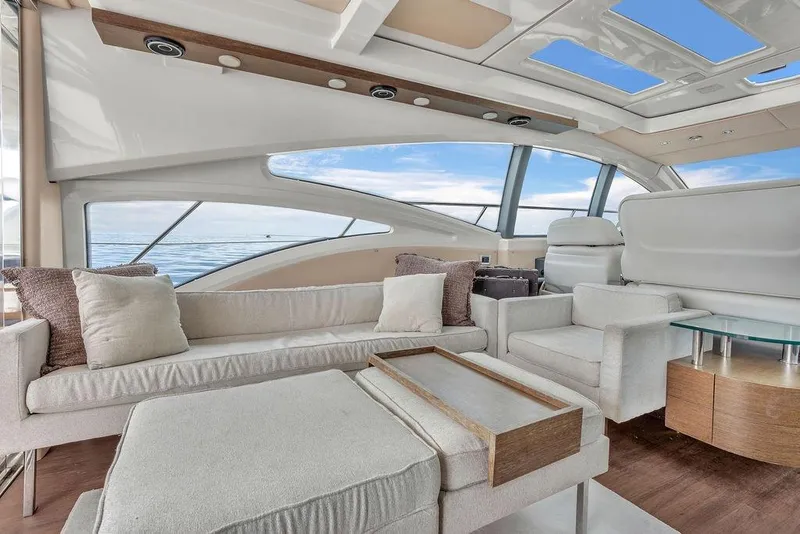 Slide: The Image of Luxurious interior of 2006 Azimut 68S yacht with modern seating and panoramic windows. - 31