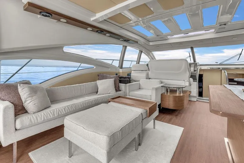 Slide: The Image of Luxurious interior of 2006 Azimut 68S yacht with modern seating and panoramic windows. - 33