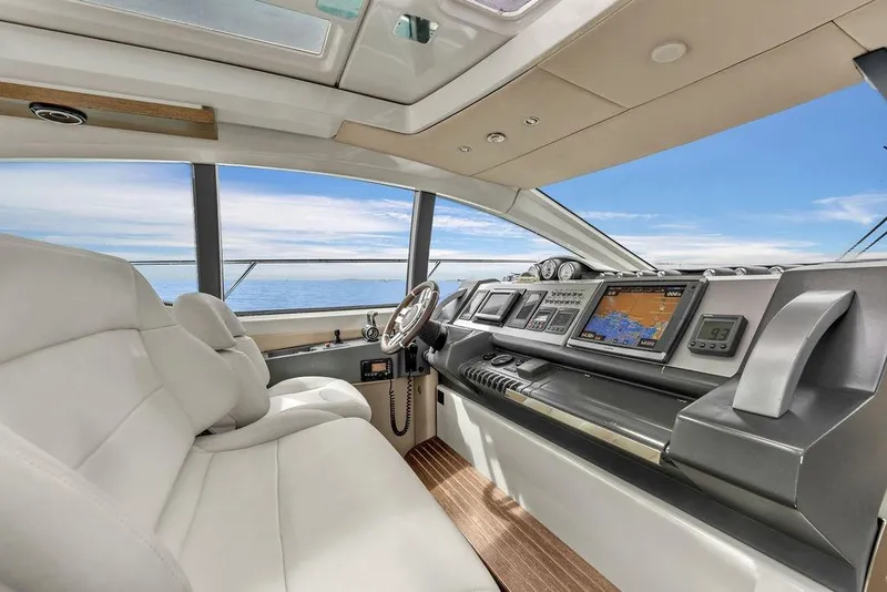 Slide: The Image of Interior of 2006 Azimut 68S yacht cockpit with navigation screens and luxurious seating. - 36