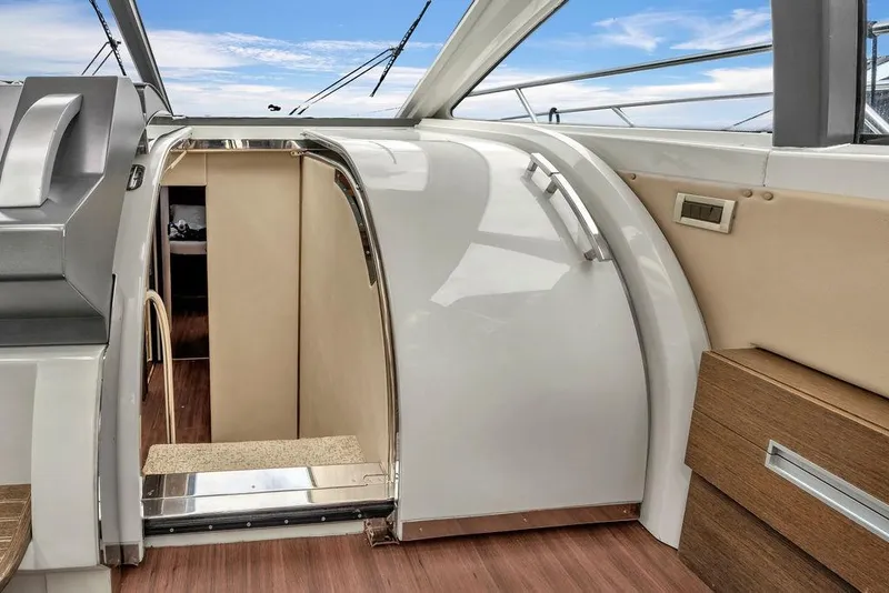 Slide: The Image of 2006 Azimut 68S yacht interior with sleek design and wooden flooring. - 40