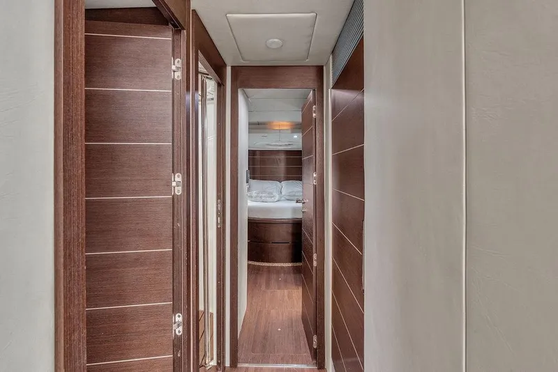 Slide: The Image of Hallway inside 2006 Azimut 68S yacht, featuring sleek wooden doors and modern design. - 43