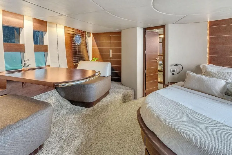 Slide: The Image of Luxurious interior of 2006 Azimut 68S yacht with elegant wood finishes and cozy seating. - 44
