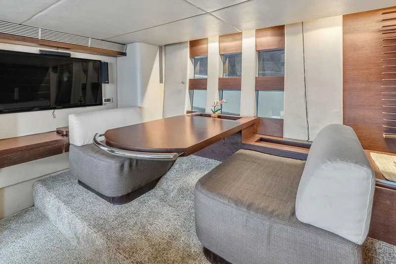 Slide: The Image of Luxurious interior of 2006 Azimut 68S yacht with modern seating and table. - 45