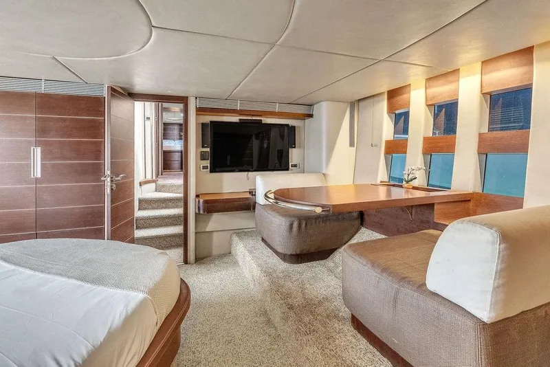 Slide: The Image of Luxurious interior of 2006 Azimut 68S yacht with modern seating and entertainment area. - 46