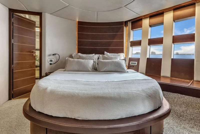 Slide: The Image of Luxurious bedroom interior of 2006 Azimut 68S yacht with modern design and large windows. - 47