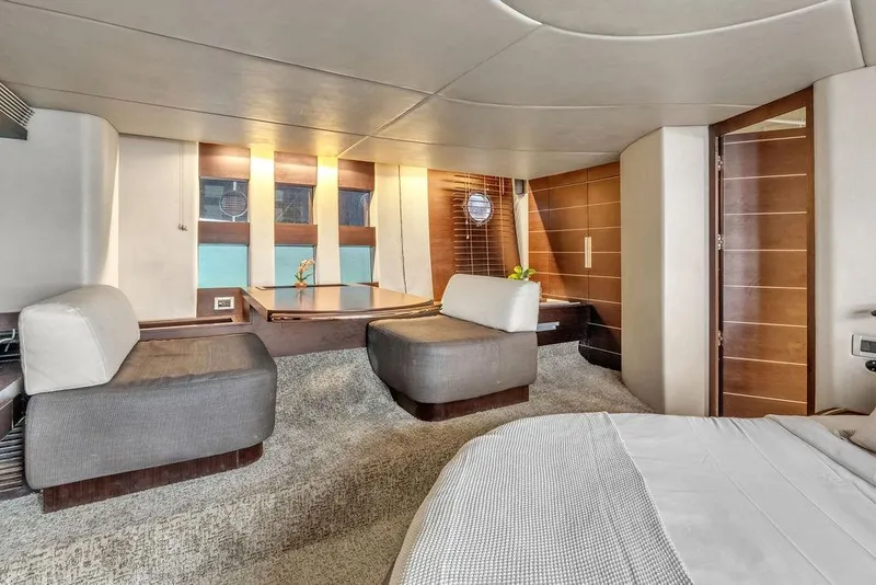 Slide: The Image of Luxurious interior of a 2006 Azimut 68S yacht, featuring modern seating and elegant wood finishes. - 49