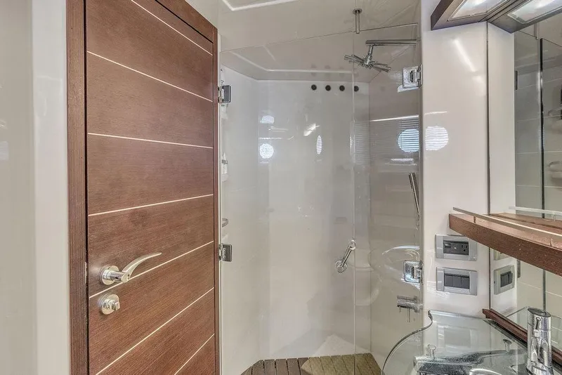 Slide: The Image of Luxurious bathroom on 2006 Azimut 68S yacht with glass shower and wooden accents. - 50
