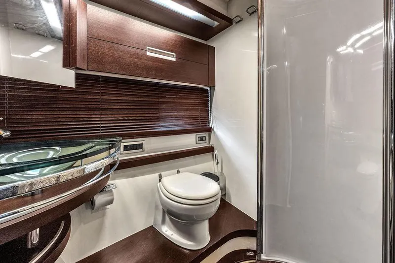 Slide: The Image of Luxurious bathroom interior of 2006 Azimut 68S yacht with modern fixtures and wood accents. - 59