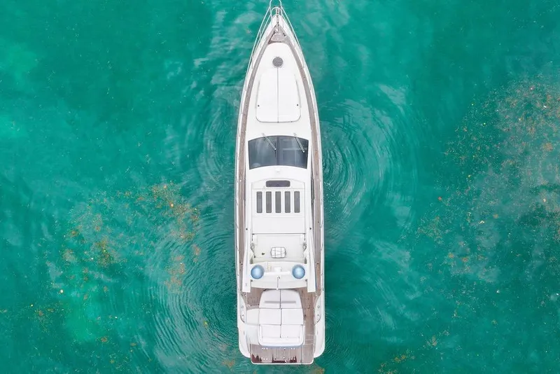 Slide: The Image of Aerial view of 2006 Azimut 68S yacht on turquoise water. - 60
