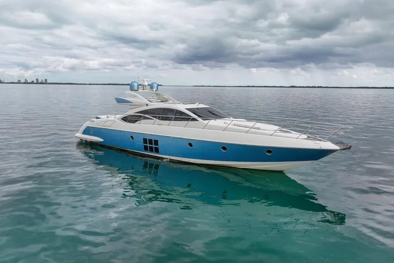 Slide: The Image of Luxury 2006 Azimut 68S yacht on calm waters under cloudy skies. - 8