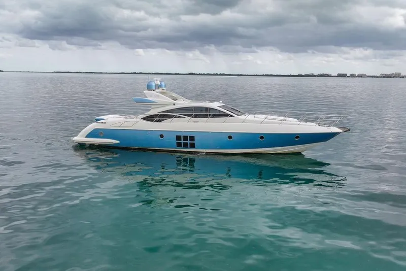 Slide: The Image of 2006 Azimut 68S yacht on calm waters under cloudy skies. - 9